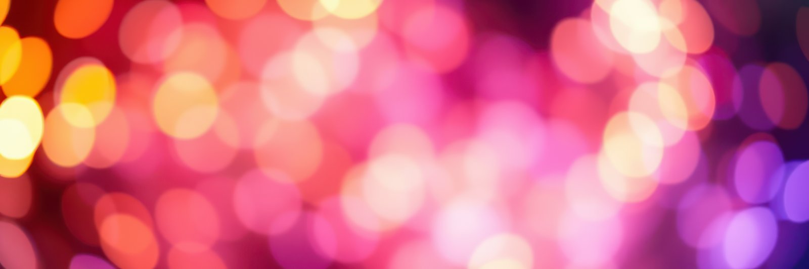 Colorful bokeh lights create a festive atmosphere for an evening celebration in a vibrant cityscape